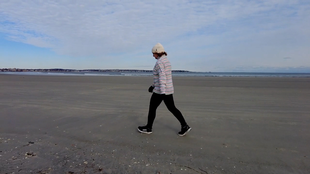 Person walkiing on the beach